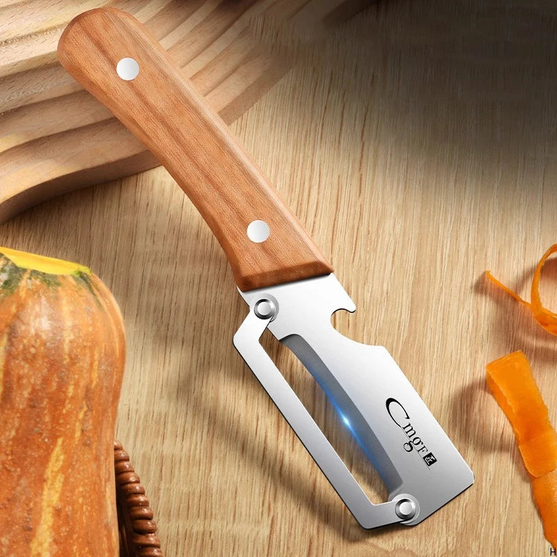 Stainless steel peeler with wooden handle for peeling and slicing - kitchen